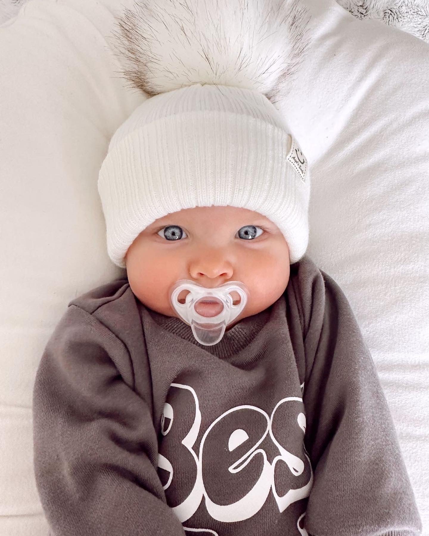 SMILEY FACE POMPOM BEANIE